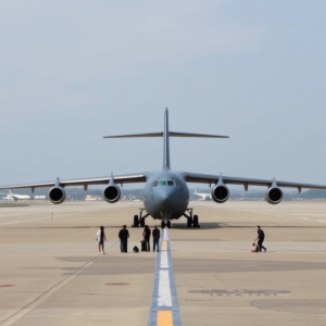 U.S. military aircraft, C-17 Globemaster III, prepared for deportation flight.
